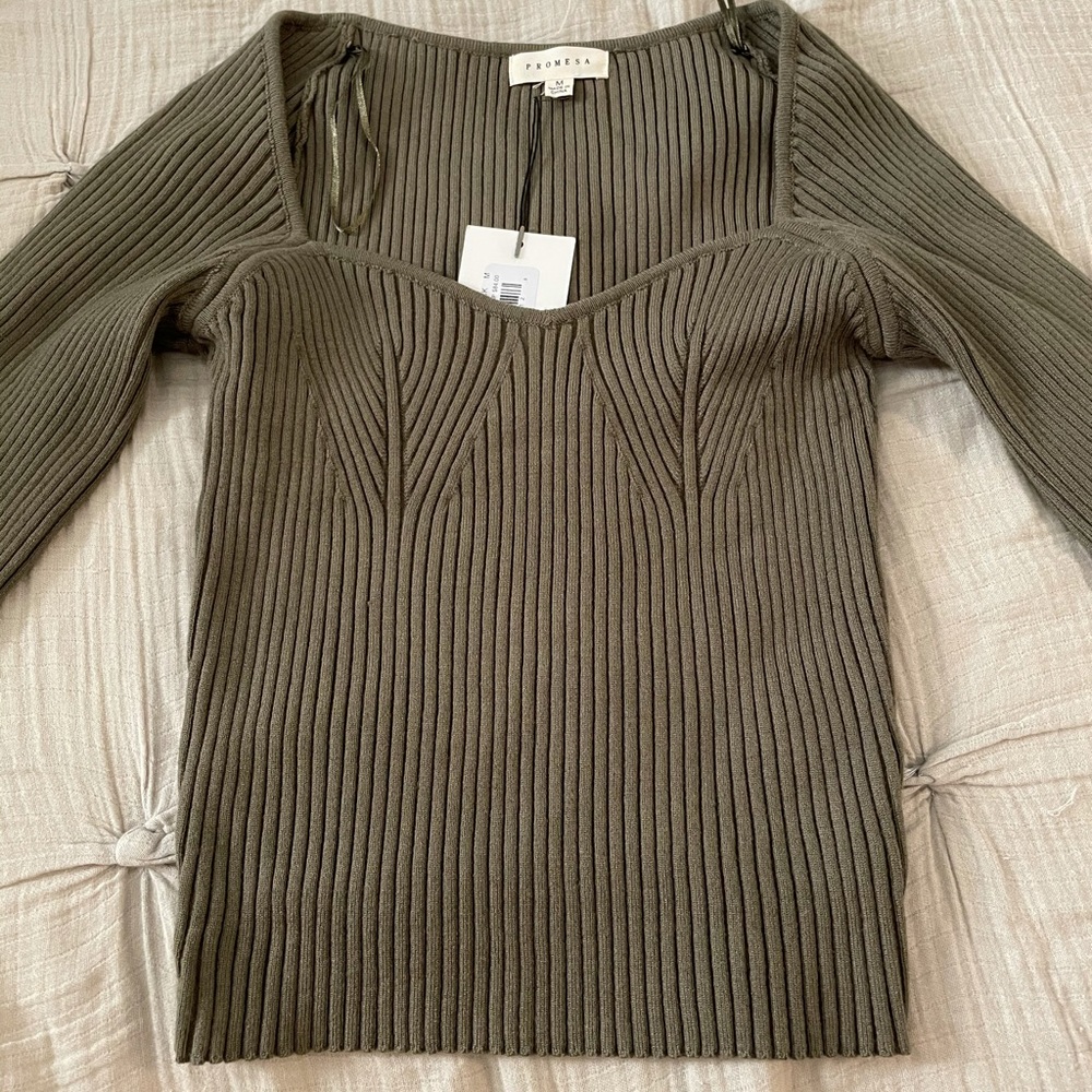 A ribbed square neck sweater in olive green.
